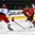 GRAND FORKS, NORTH DAKOTA - APRIL 16: Switzerland's Nico Hischier #13 skates with the puck while Russia's Veniamin Baranov #7 defends during preliminary round action at the 2016 IIHF Ice Hockey U18 World Championship. (Photo by Matt Zambonin/HHOF-IIHF Images)

